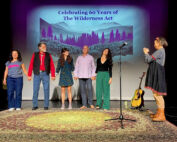 group of people standing on a stage